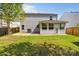 Backyard featuring a patio, an AC unit, and a fenced-in yard, offering privacy and space at 10937 Dry Stone Dr, Huntersville, NC 28078