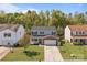 Charming two-story home with brick accents, a well-manicured lawn, and a two-car garage at 10937 Dry Stone Dr, Huntersville, NC 28078