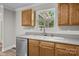 This kitchen features stainless appliances, tile backsplash, solid surface countertops, and a modern sink at 10937 Dry Stone Dr, Huntersville, NC 28078