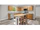 Bright kitchen with stainless appliances, plenty of cabinet space, tile backsplash, and a kitchen island at 10937 Dry Stone Dr, Huntersville, NC 28078