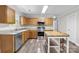 This classic kitchen offers stainless appliances, tile backsplash, and a wooden island with seating at 10937 Dry Stone Dr, Huntersville, NC 28078