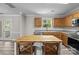 Bright kitchen features stainless steel appliances, light wood cabinets and a center island at 10937 Dry Stone Dr, Huntersville, NC 28078
