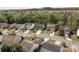 A wide shot of houses lining a street, in a quiet neighborhood with mature trees at 10937 Dry Stone Dr, Huntersville, NC 28078