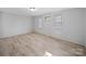 Bright bedroom with neutral tones, fresh paint, and new flooring at 1142 Mona Dr, Charlotte, NC 28206