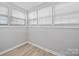 Bright bedroom featuring fresh neutral paint, updated flooring, and ample natural light at 1142 Mona Dr, Charlotte, NC 28206