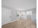 Bright, updated bedroom featuring wood-look flooring and natural light at 1142 Mona Dr, Charlotte, NC 28206
