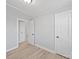 This bedroom features neutral walls, base trim, and wood-look floors at 1142 Mona Dr, Charlotte, NC 28206
