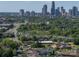 A distant cityscape view with verdant green trees in the foreground near residential areas at 1142 Mona Dr, Charlotte, NC 28206