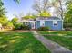 A well-kept home with a neatly landscaped lawn and charming curb appeal at 1142 Mona Dr, Charlotte, NC 28206