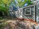 Exterior of home with backyard patio, showcasing a backyard entrance and outdoor living at 1142 Mona Dr, Charlotte, NC 28206