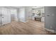 Bright living room with modern wood flooring and neutral paint at 1142 Mona Dr, Charlotte, NC 28206