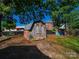 Backyard shed for storage with a rustic, weathered appearance among mature trees at 1142 Mona Dr, Charlotte, NC 28206