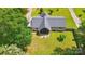 A bird's-eye view of a home with mature trees and a lush green lawn at 116 Pelham Ln, Fort Mill, SC 29715