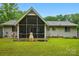Lovely screened porch in a well-maintained backyard with manicured lawn at 116 Pelham Ln, Fort Mill, SC 29715