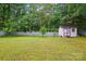 A spacious backyard featuring a storage shed and partial fence at 116 Pelham Ln, Fort Mill, SC 29715