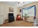 Bedroom featuring a ceiling fan, neutral walls, and a comfy chair near a window with a houseplant at 116 Pelham Ln, Fort Mill, SC 29715