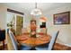 Formal dining room featuring a round table, seating for four, and views to the kitchen and living spaces at 116 Pelham Ln, Fort Mill, SC 29715
