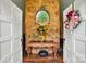 Welcoming foyer featuring a stone wall, elegant table, and decorative accents at 116 Pelham Ln, Fort Mill, SC 29715