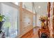 Bright foyer with large windows, hardwood floors, and decorative vase on a wood table at 116 Pelham Ln, Fort Mill, SC 29715