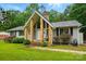 Inviting home exterior with stone accents, manicured lawn, and vibrant landscaping at 116 Pelham Ln, Fort Mill, SC 29715