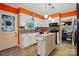 Bright kitchen with white cabinets, granite countertops, and an island with butcher block countertop at 116 Pelham Ln, Fort Mill, SC 29715