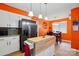 Charming kitchen with white cabinets, a portable island, and an adjacent dining area at 116 Pelham Ln, Fort Mill, SC 29715