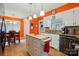 Cozy kitchen featuring white cabinets, granite countertops, island, and adjacent dining room at 116 Pelham Ln, Fort Mill, SC 29715