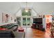 Inviting living room featuring vaulted ceilings, large windows and view to backyard at 116 Pelham Ln, Fort Mill, SC 29715
