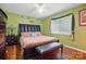 Comfortable bedroom with a plush bed, dark furniture, and natural light at 116 Pelham Ln, Fort Mill, SC 29715