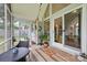 Inviting screened porch with outdoor seating and views of the garden and backyard at 116 Pelham Ln, Fort Mill, SC 29715