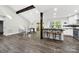 Stylish kitchen with dark countertop island, hardwood floors, and open dining area, perfect for entertaining at 11914 Rock Canyon Dr, Charlotte, NC 28226