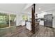 Modern kitchen with stainless steel appliances, white cabinets, hardwood floors, and a backyard view at 11914 Rock Canyon Dr, Charlotte, NC 28226