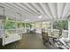 Relaxing screened porch featuring comfortable seating and a dining area for outdoor enjoyment at 11914 Rock Canyon Dr, Charlotte, NC 28226