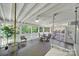 Relaxing screened porch featuring comfortable seating and a dining area for outdoor enjoyment at 11914 Rock Canyon Dr, Charlotte, NC 28226