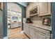 Stylish bar area with granite countertops, wine rack, and decorative accents at 12525 Hashanli Pl, Matthews, NC 28105
