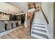 Grand foyer with staircase and railing leading to the upper level at 12525 Hashanli Pl, Matthews, NC 28105