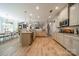 Open-concept kitchen with granite countertops, stainless steel appliances, and custom cabinetry at 12525 Hashanli Pl, Matthews, NC 28105