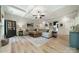 Comfortable living room with sectional sofa, wooden coffee table, and modern decor at 12525 Hashanli Pl, Matthews, NC 28105
