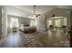 This spacious main bedroom features beautiful hardwood floors and lots of natural light at 12525 Hashanli Pl, Matthews, NC 28105