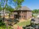 Aerial view of the home's backyard and patio with space for outdoor seating and entertainment at 12525 Hashanli Pl, Matthews, NC 28105