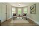 A peaceful nook enhanced by natural light and neutral tones provides a relaxing retreat at 12525 Hashanli Pl, Matthews, NC 28105