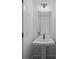Minimalist half bathroom with a pedestal sink, and a clean, modern design at 130B Springway Dr, Kannapolis, NC 28081