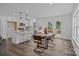 Open dining area and kitchen featuring stainless appliances, an island, and access to back deck at 130B Springway Dr, Kannapolis, NC 28081
