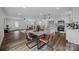 Open dining and kitchen area with modern decor, stainless appliances, and hardwood floors at 130B Springway Dr, Kannapolis, NC 28081