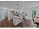 Bright kitchen features white cabinets, a center island with seating, and stainless steel appliances at 130B Springway Dr, Kannapolis, NC 28081