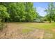 A beautiful lot surrounded by mature trees and an existing structure on the property at 1317 Requa Rd, Cherryville, NC 28021