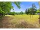 A spacious grassy front yard with tree coverage, perfect for outdoor activities and relaxation at 1317 Requa Rd, Cherryville, NC 28021