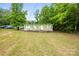 Exterior view of a modest home with a well-maintained yard, cars and some trees around it at 1317 Requa Rd, Cherryville, NC 28021