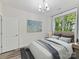 Comfortable bedroom featuring a large window, and modern decor at 1409 Bloomsberry Ln, Waxhaw, NC 28173