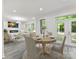 Bright dining area flows into a living room with fireplace and backyard access at 1409 Bloomsberry Ln, Waxhaw, NC 28173